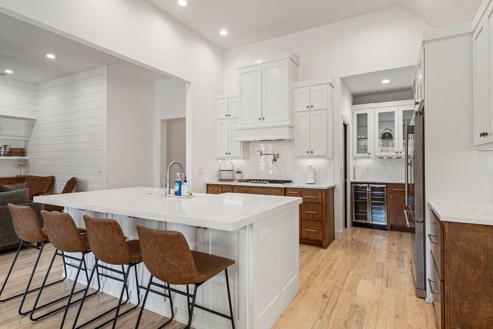 Kitchen with wine fridge and walk-in pantry