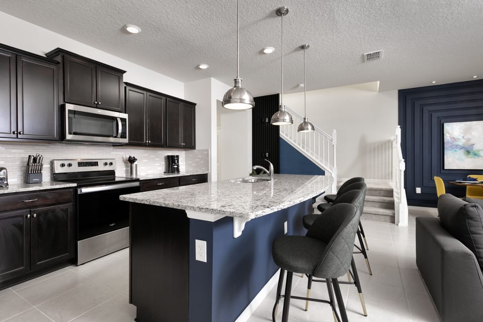 This kitchen with modern appliances makes cooking enjoyable.