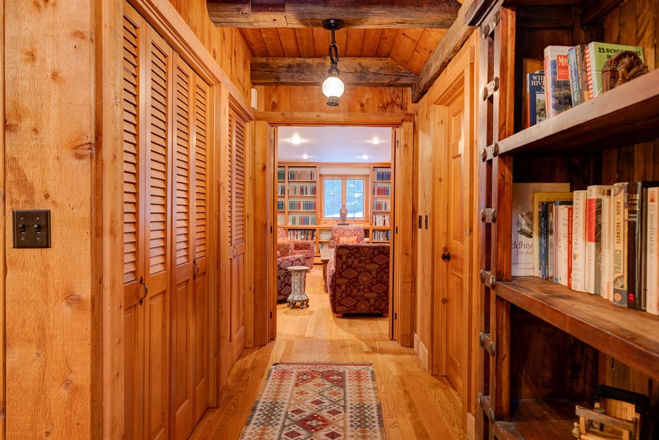 Hallway connecting the living room and the library/TV room