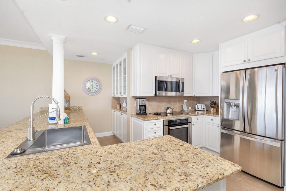 Your gourmet kitchen awaits with granite countertops, stainless steel appliances, and everything you need to create memorable meals during your stay.