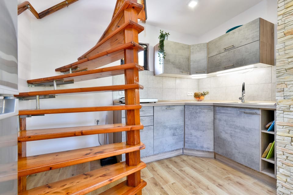 Kitchen with stairs to the upper floor