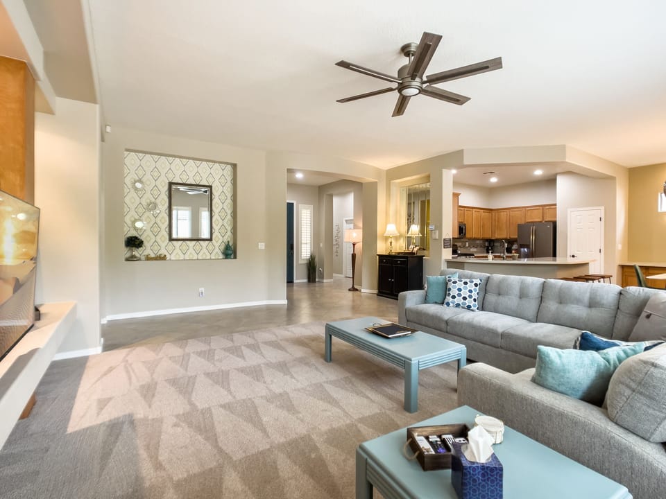 Living room view toward foyer and kitchen.