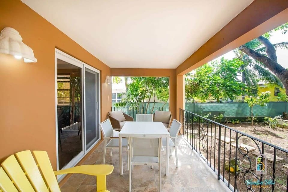Enjoy morning coffee or evening drinks on this peaceful balcony surrounded by nature.