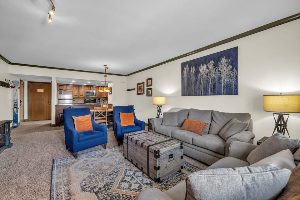 Kick back and relax in the inviting family room where you will find plush furnishings, a flat-screen TV, a lovely stone hearth fireplace, and access to the private balcony.