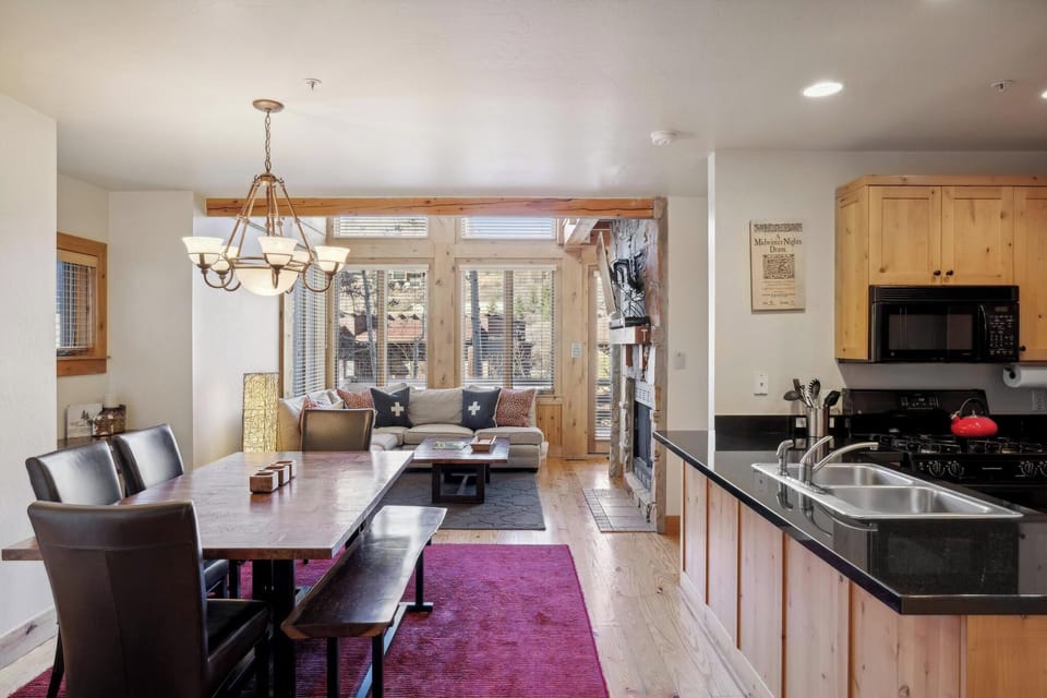 Dining Room: 6-person dining table, open layout to living room and kitchen