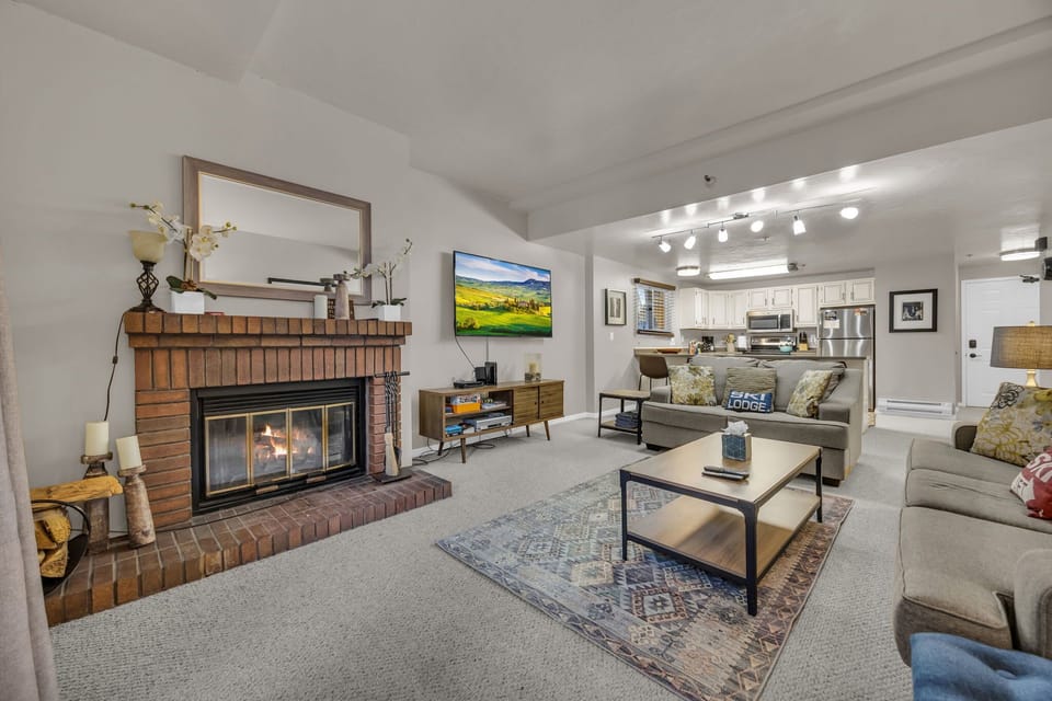 Living room: TV with cable, wood-burning fireplace (starter bundle of wood provided), electric baseboard heating, no A/C