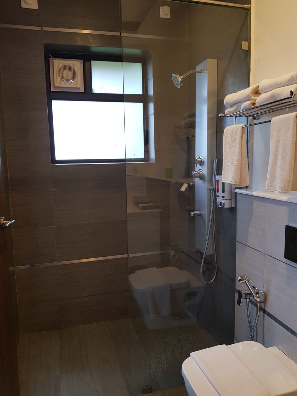 Shower, rainfall showerhead, designer toiletries, hair dryer