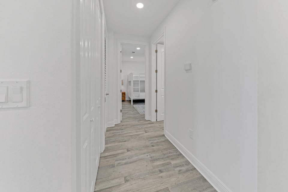 Hallway With Washer and Dryer in Closet To The Left