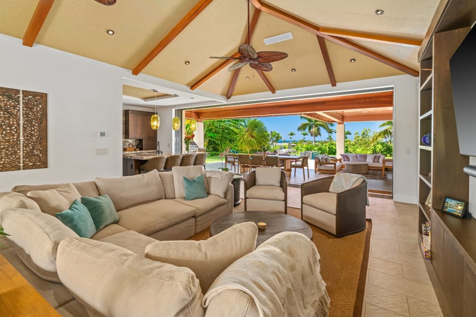 Maluhia Makai - Living great room & fully furnished outdoor lanai flows seamlessly together as one open space with pocket doors fully open. -Legacy Vacations Hawaii