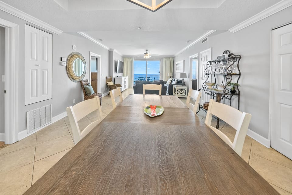 Gather around this spacious dining table where memorable meals await, with stunning ocean views framing your every conversation.