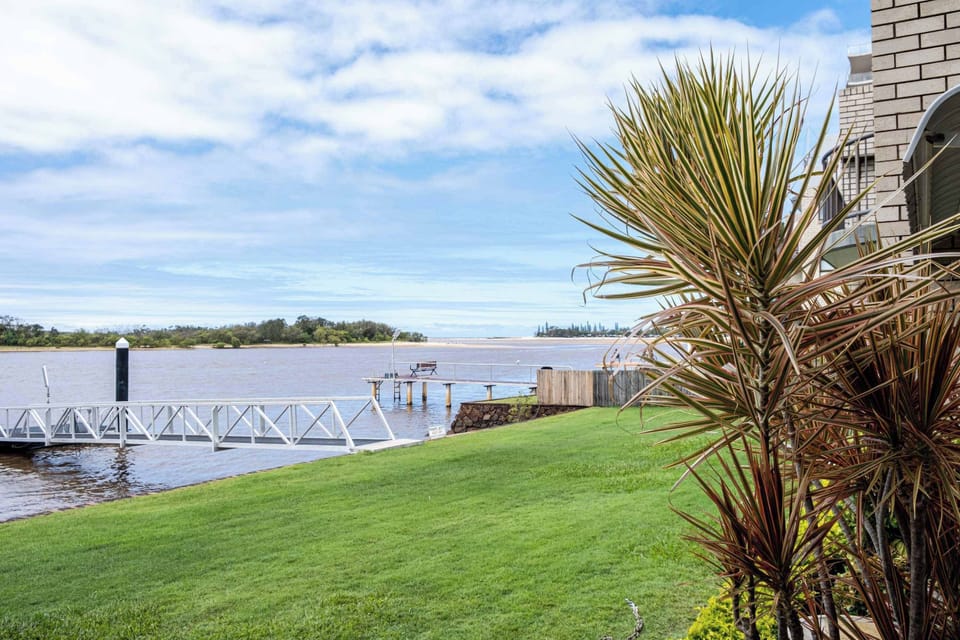 View of the grassed area and river from the patio.