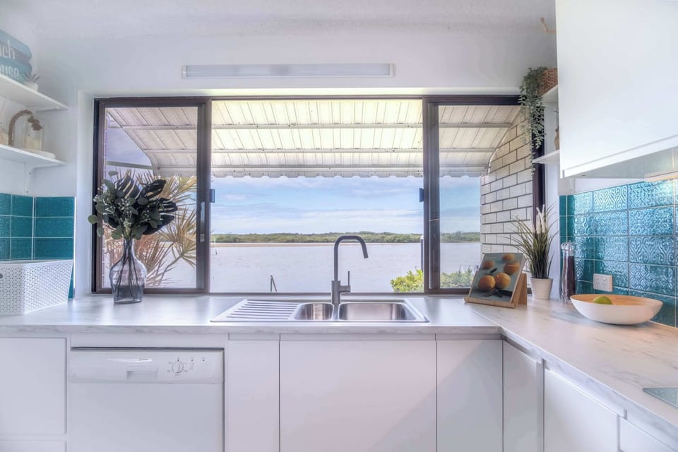 Kitchen window directly facing the Maroochy River.