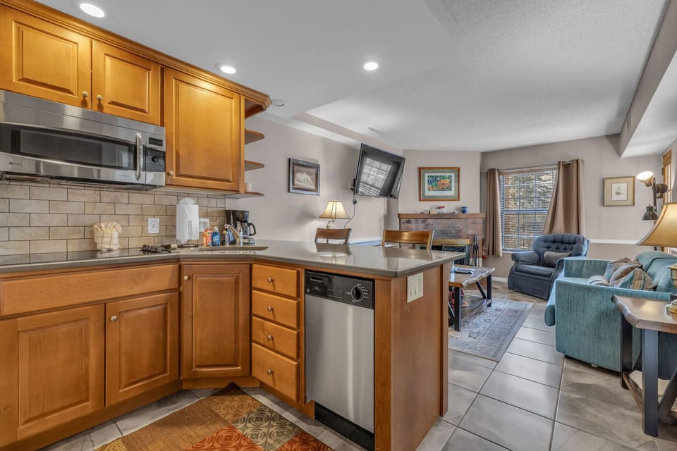 Fully-equipped kitchen with breakfast bar seating for up to 3