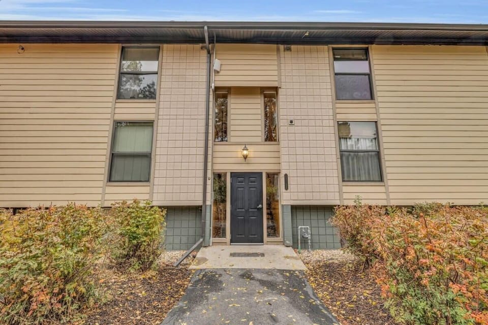 An exterior view of the building the condo is located in front of the building entrance.