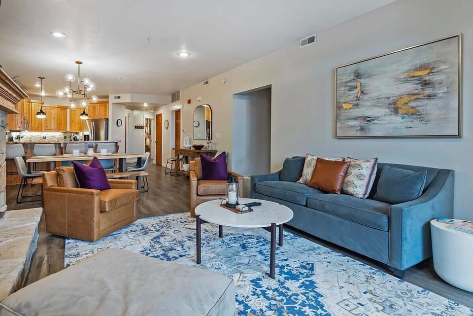 The well-decorated living room is connected to the dining area and kitchen, keeping you central to your group while you warm up by the fire and relax on the comfortable furniture.