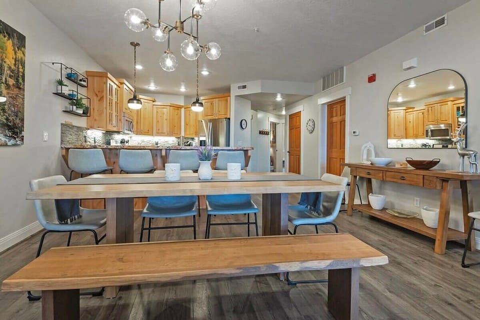 The stylish dining room features a table with seating for six conveniently located next to the kitchen where you will find a kitchen bar with additional seating for four.
