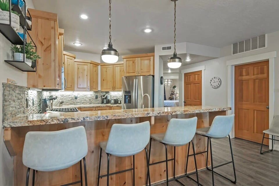 The kitchen bar is the perfect place to grab a quick snack or hang out while keeping the chef company.