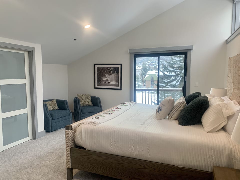 Upstairs primary bedroom with king bed