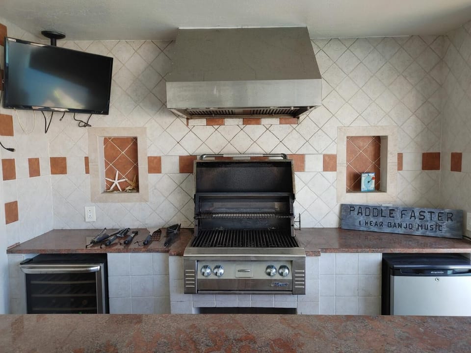 This awesome outdoor kitchen is ready! Note, TV is no longer present. 