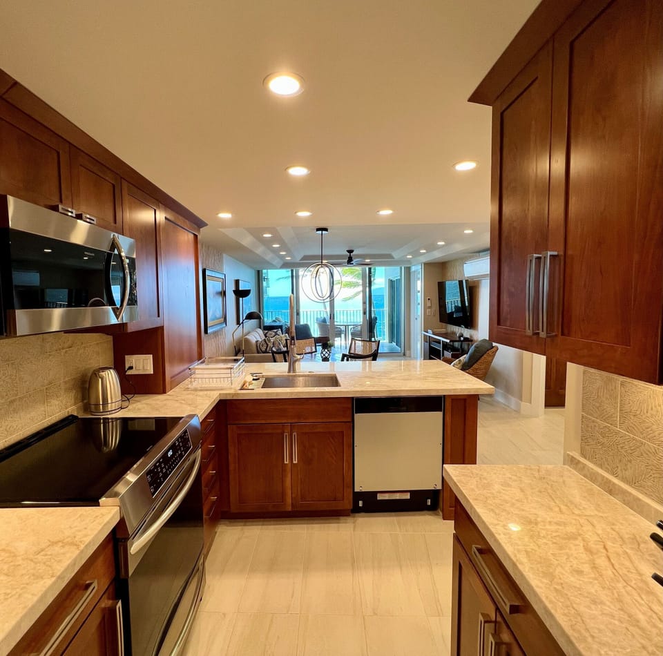Modern and fully-equipped kitchen with induction stovetop for easy meal prep.
