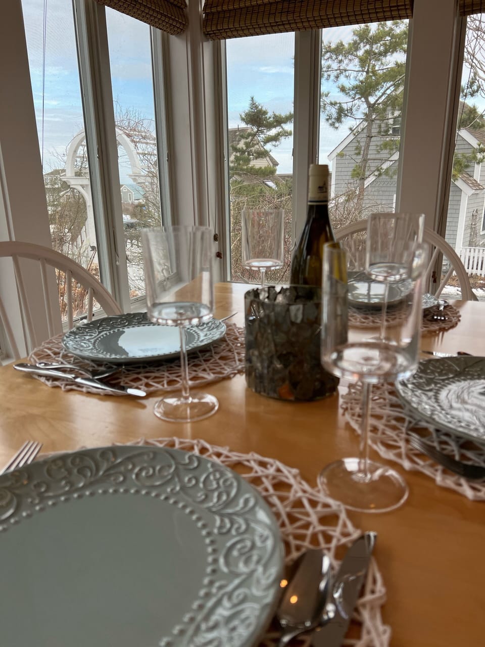 Dining table with view of ocean in the sunroom 