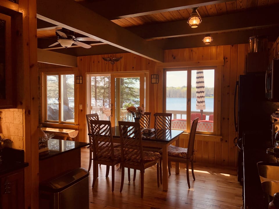 View from kitchen/ living room area overlooking main deck and lake