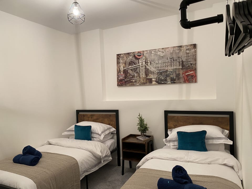 This comfortable room offers a comfortable bed with soft linens and warm lighting, creating a peaceful atmosphere. 