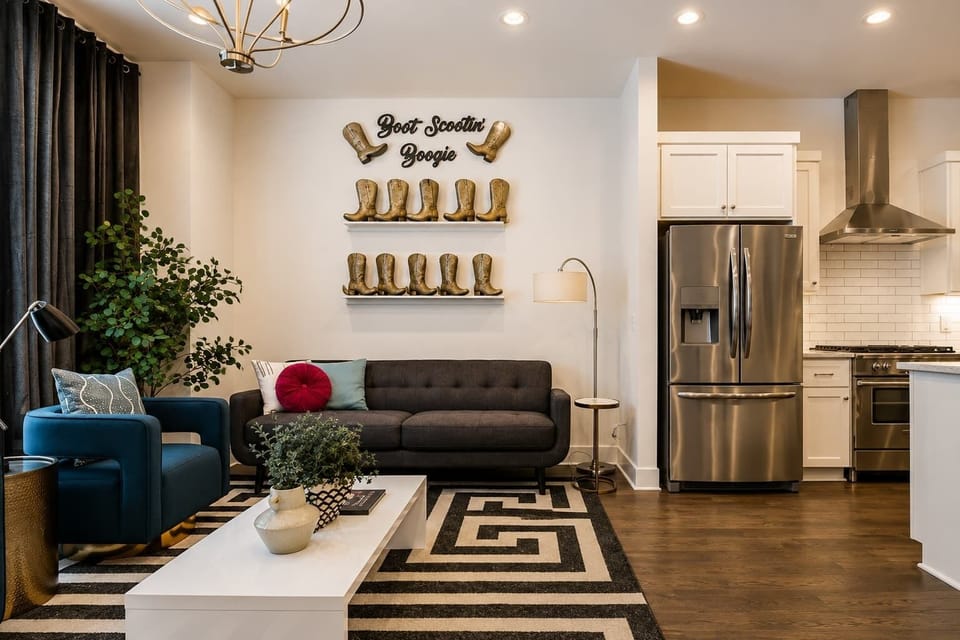 Living room with ample space, cozy feel, and cowboy boot touches.