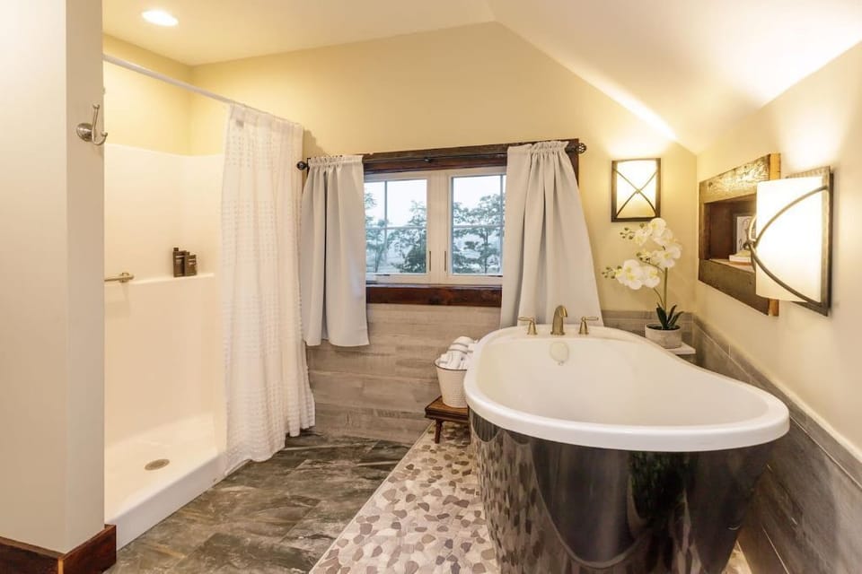 "Elegant bathroom with a luxurious freestanding tub, perfect for relaxing .