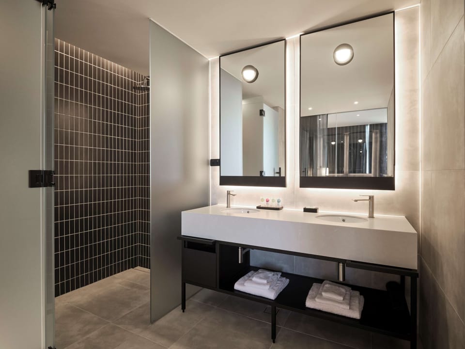 Shower, rainfall showerhead, designer toiletries, hair dryer