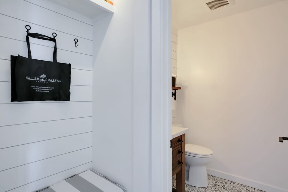 Lovely half bathroom with all the essentials for guests to use.