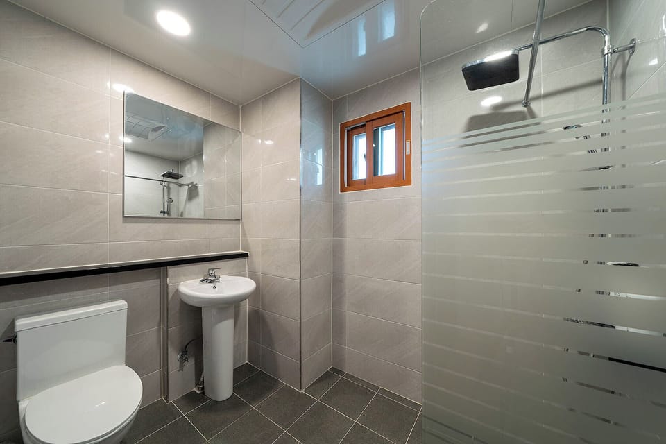 Designer toiletries, hair dryer, bathrobes, slippers