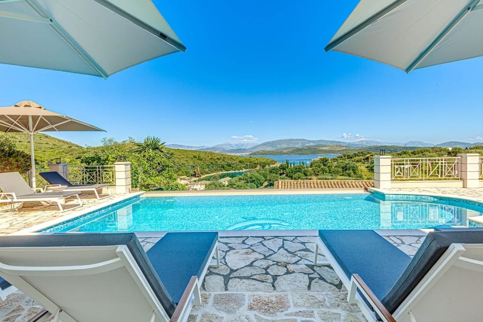 Outdoor pool, a heated pool, pool umbrellas, sun loungers