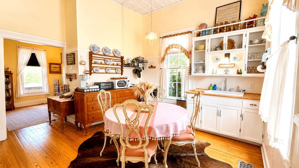 French provincial dining set, farm sink, soaring pressed tin ceiling, chandelier