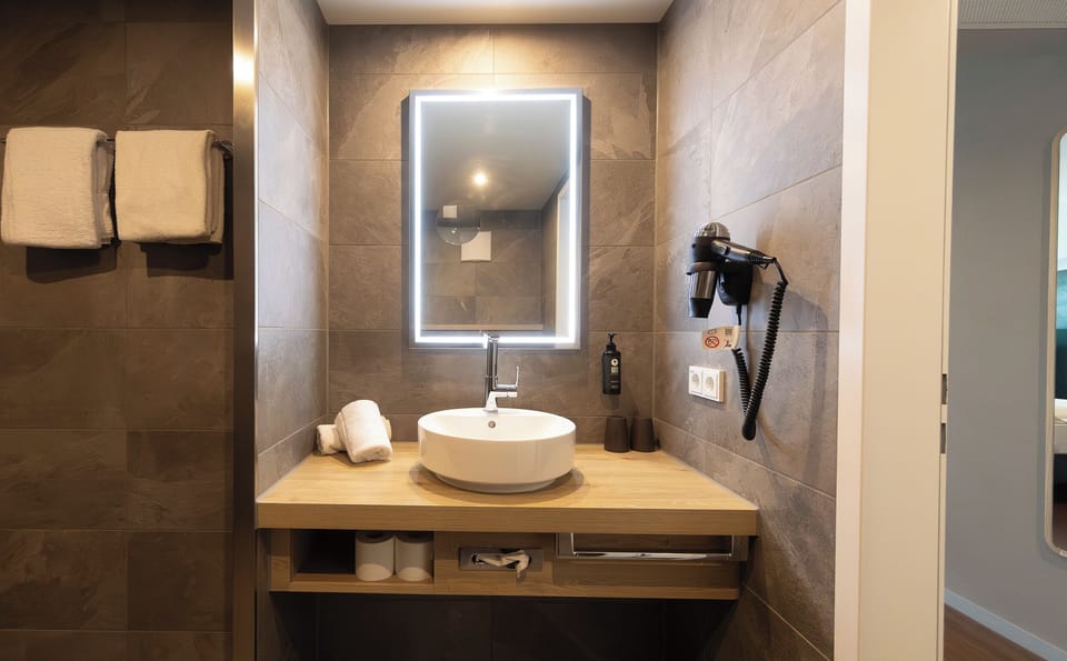 Hair dryer, towels, soap, shampoo