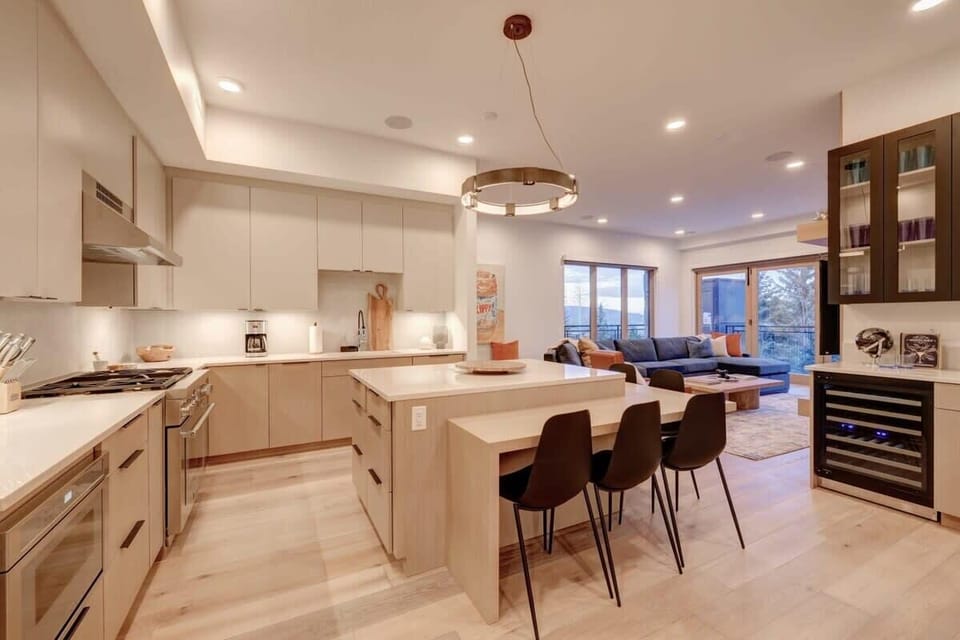 Gourmet kitchen with Thermador appliances, breakfast bar seating for 5