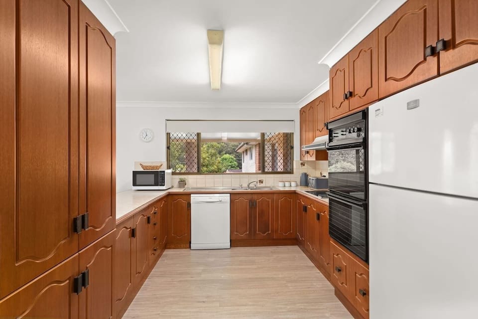 Fully equipped kitchen with stove,oven, microwave,dishwasher, fridge, air fryer.