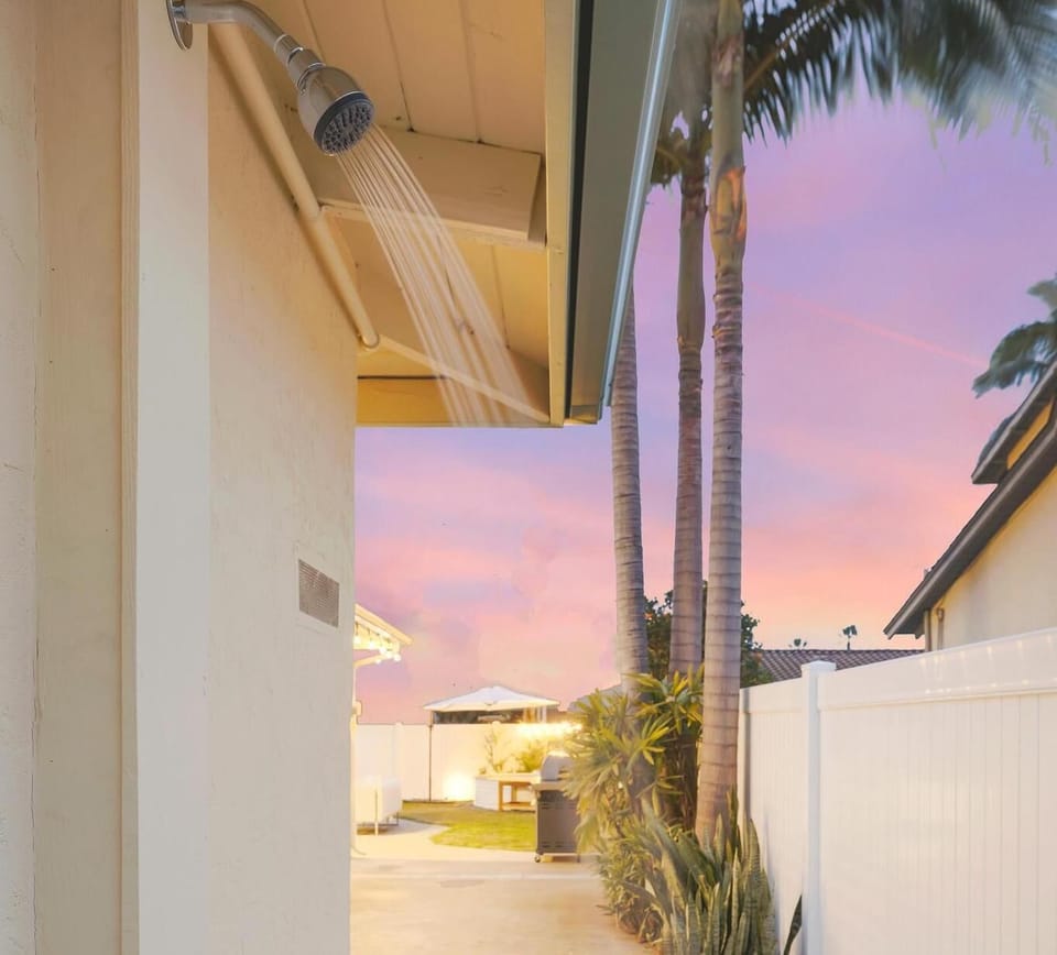Private outdoor shower overlooking the backyard. Perfect for a rinse after the beach.