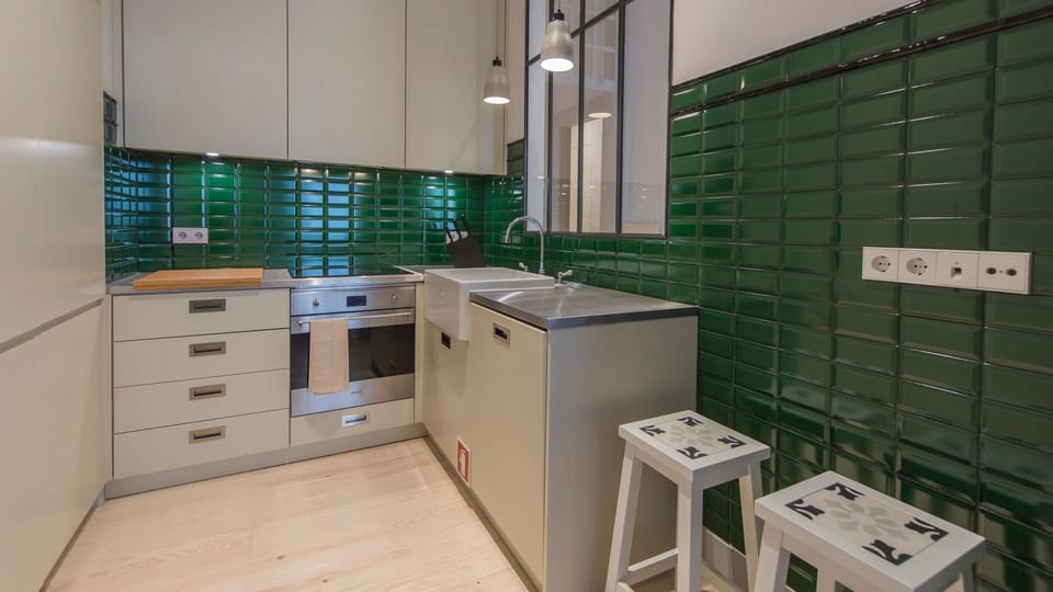 Lovely moss-colored tiles in the kitchen give it a unique vibe #kitchen #appliances