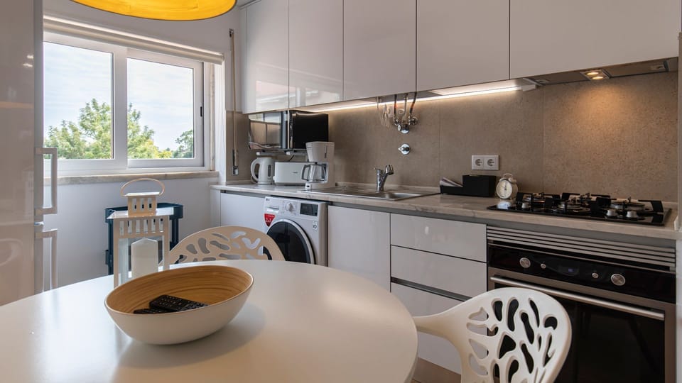 Fully equipped kitchen with modern appliances and a washing machine! #cooking #modern