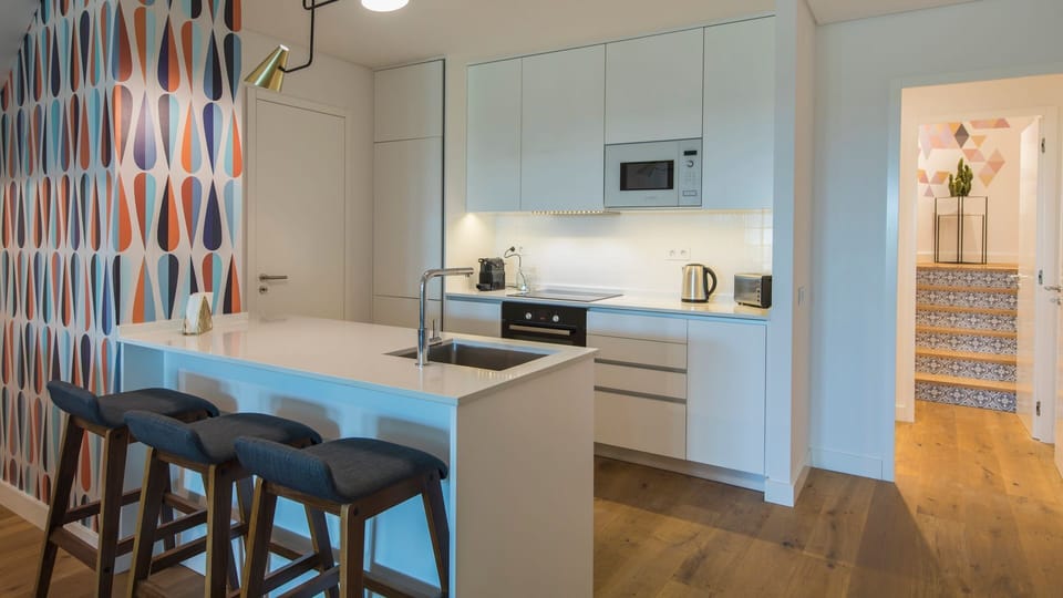 Prepare delicious meals and enjoy casual dining at the stylish breakfast bar, perfect for quick bites or socializing while cooking. The sleek, modern kitchen is thoughtfully equipped, making meal preparation effortless and enjoyable. 
#ModernKitchen #Brea