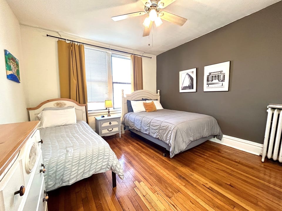 2nd bedroom with queen and twin beds. Closet and dresser for clothes.
