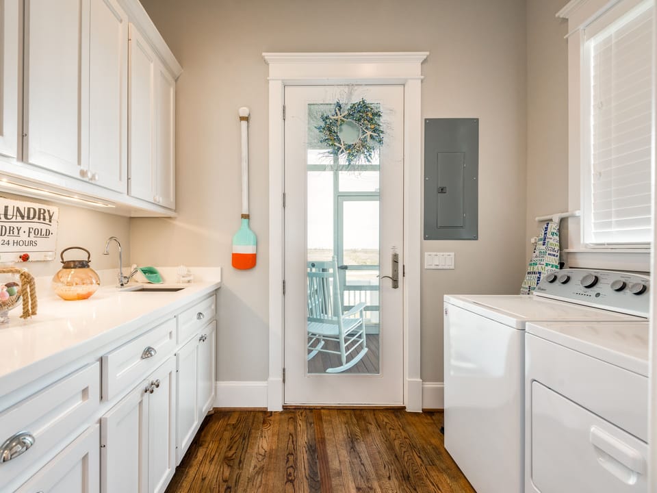 Utility room with full size washer and dryer