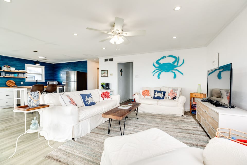 Open living area with cool coastal color palette
