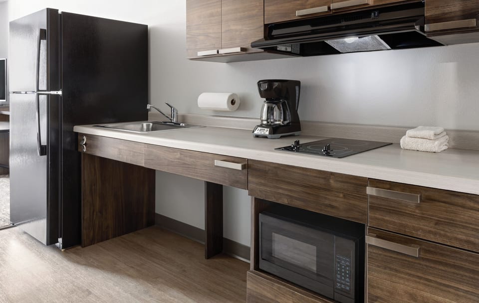 Comfort Room, 1 Queen Bed (Hearing Impaired Roll In Shower) | Private kitchen | Full-size fridge, microwave, stovetop, coffee/tea maker