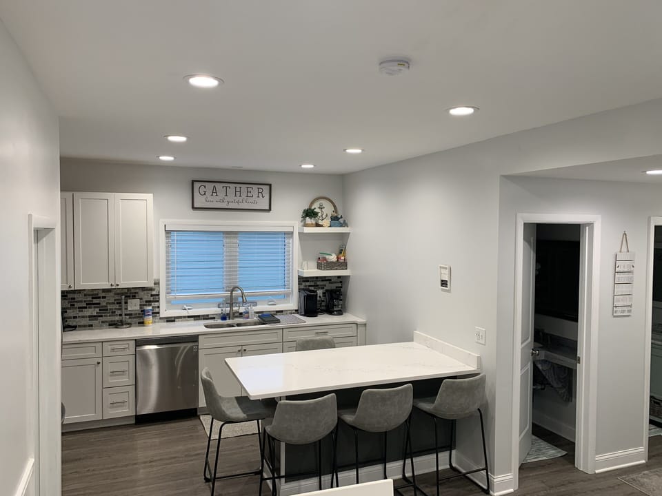 Open Kitchen - new stainless steel appliances, & kitchen island area. 