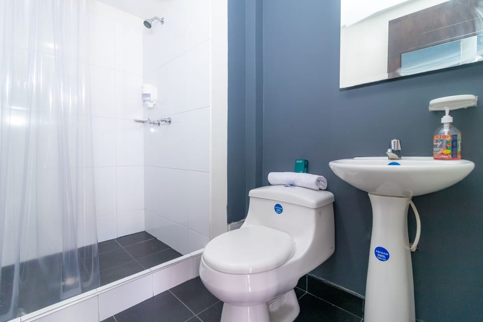 Quadruple Room | Bathroom | Shower, free toiletries, towels, soap