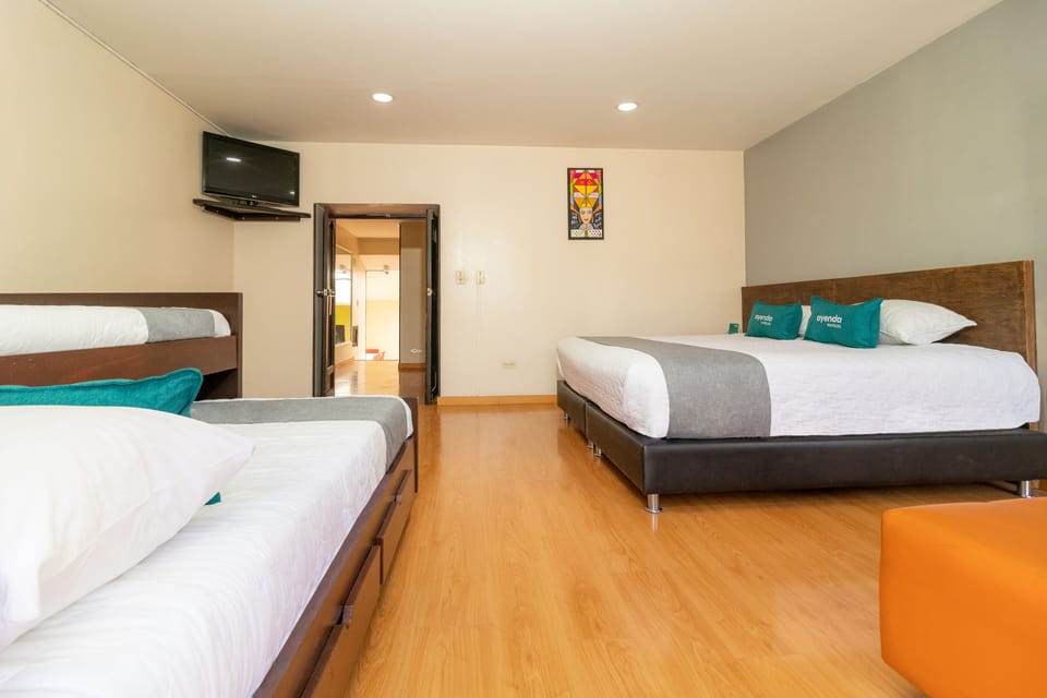 Quadruple Room | Hypo-allergenic bedding, iron/ironing board, free WiFi, bed sheets
