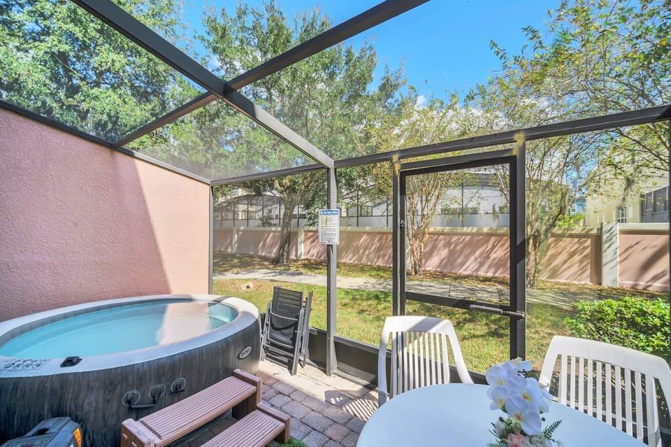 screened patio with private hot tub