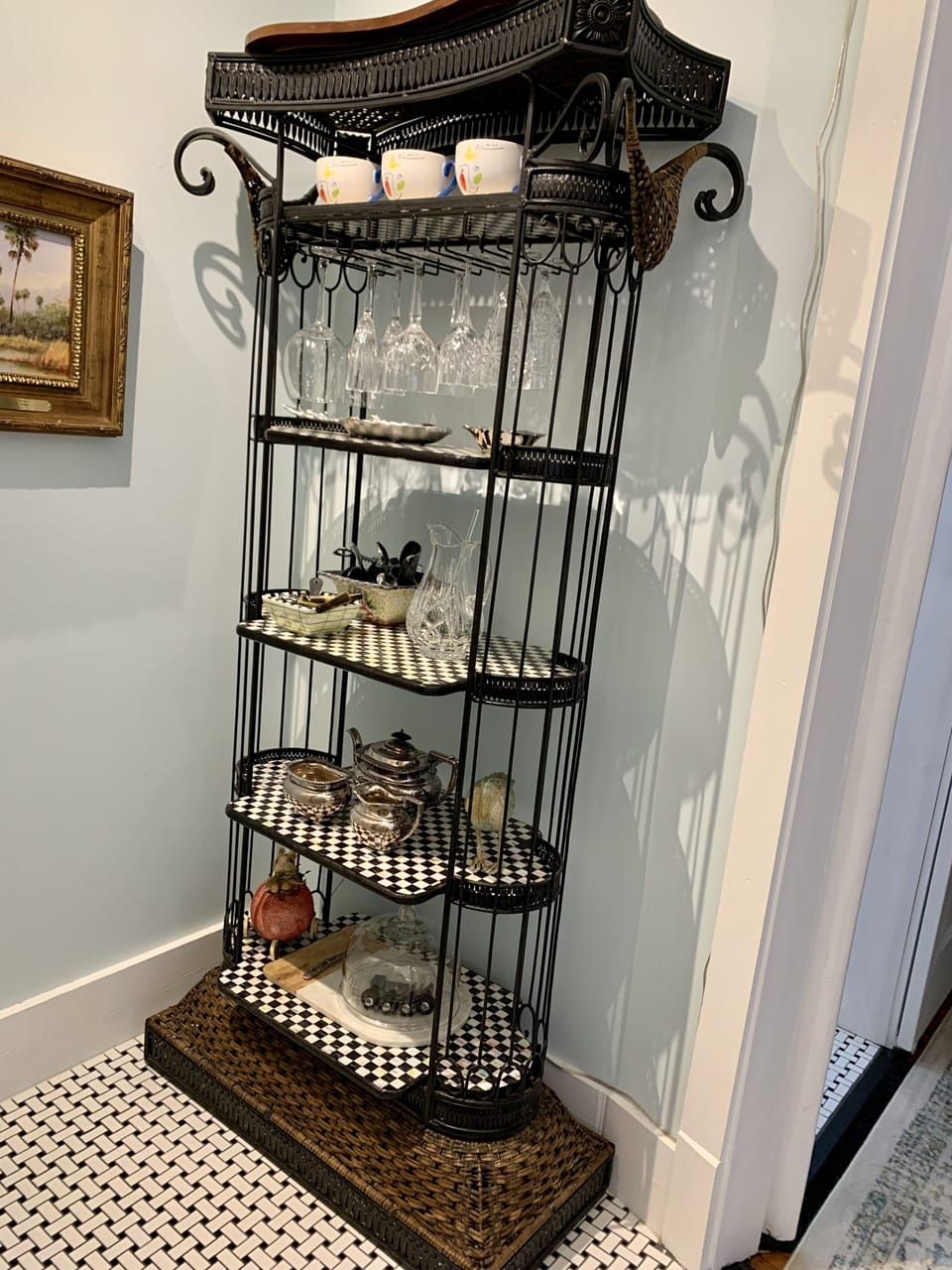 Etagere with bar glasses and barware